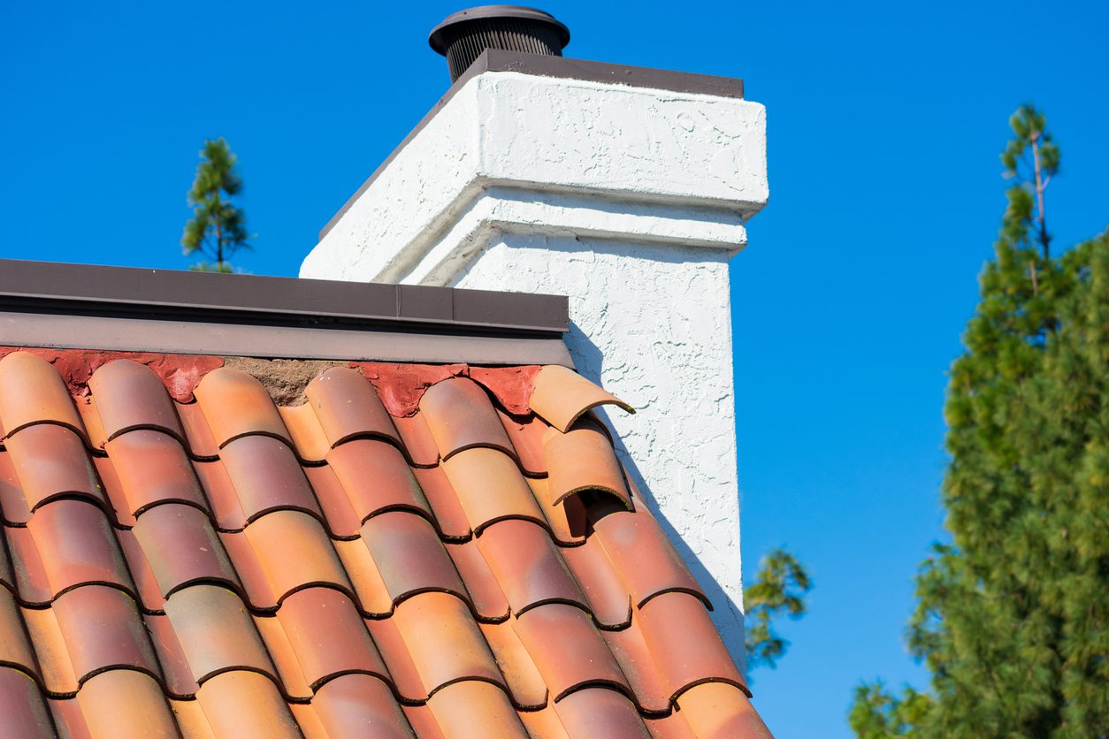 Roof tiles shifted by strong winds during storm require repair to prevent water leak and interior damage